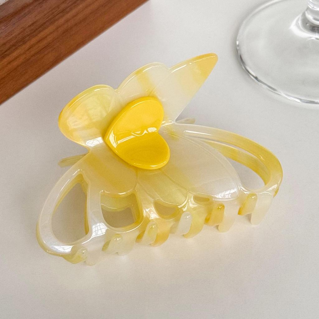 Dorei Accessories Snygg Hårklämma i Acetat med Hjärta och Fjäril för Eleganta Uppläggningar