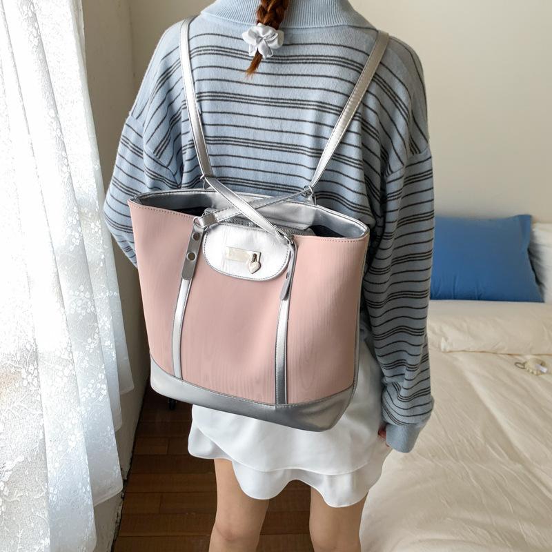 

Korean version of large-capacity backpack women s 2025 new simple and versatile shoulder tote bag high-end multi-functional backpack рожевий