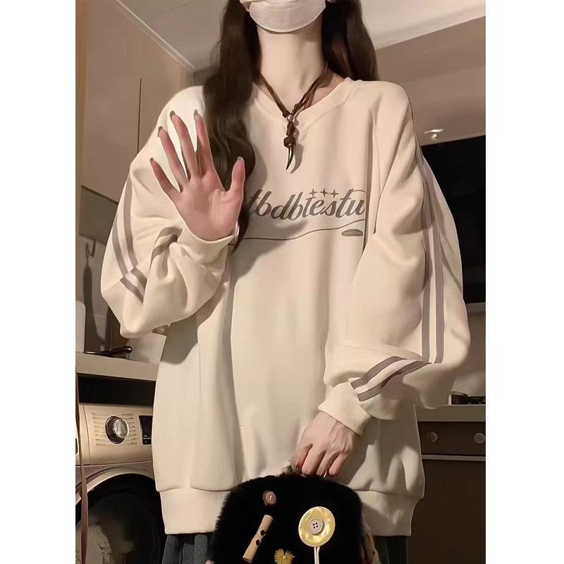 Bluza damska w paski z dekoltem w serek - Kolekcja Wiosna/Jesień 2024