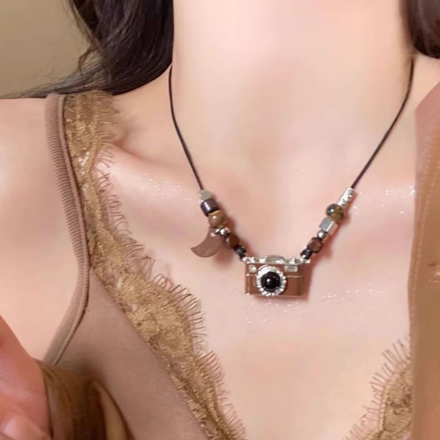 

Retro brown camera pearl necklace women s light luxury niche design versatile unique personality long chain sweater chain accessories
