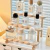 This 3-layer perfume storage rack is made of wood and is suitable for storing and displaying items