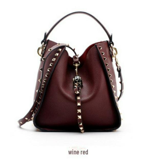 Women's Retro Rivet Cowhide Bucket Bag with Leopard Head Design