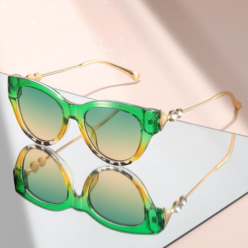 New cat-eye sunglasses with diamond-like embellishments on metal temples for a high-end versatile look