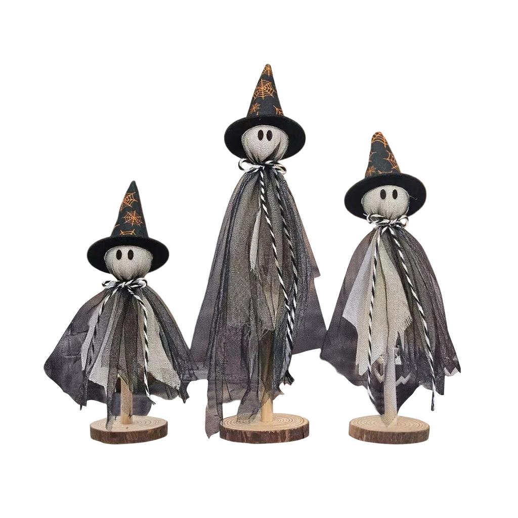 Three Halloween Are Placed On A Wooden Stand In The Center Of The Halloween Desktop For Indoor Decoration