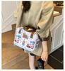 Single-shoulder slanted crossbody baby bag, cute cartoon design, large capacity, water-resistant, suitable for moms to carry out