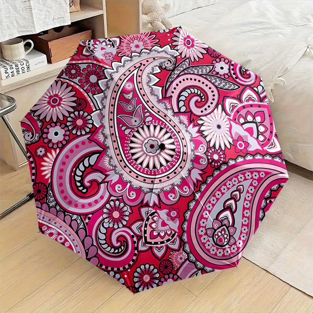 

Folding Umbrella The umbrella features a vibrant paisley pattern with intricate floral and mandala designs, prominently showca Iron&8K