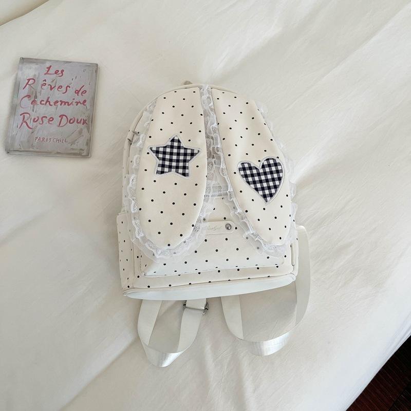 Schoolbag handsome rice family Korean simple foreign style polka dot love rabbit ear backpack 1011 spring new commuter student backpack