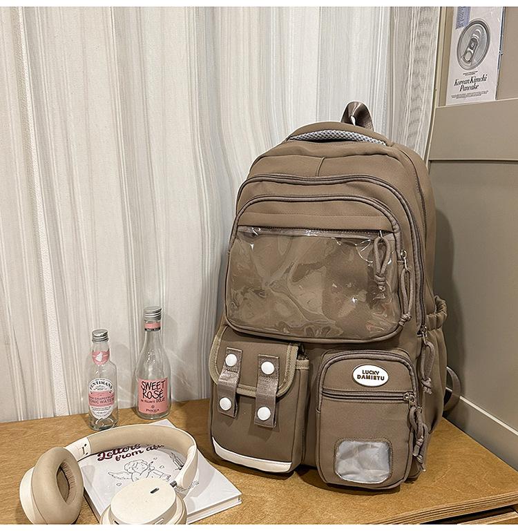 

New high-value college backpack, casual and simple for junior high school students, lightweight for commuting, versatile and large-capacity backpack. коричневий
