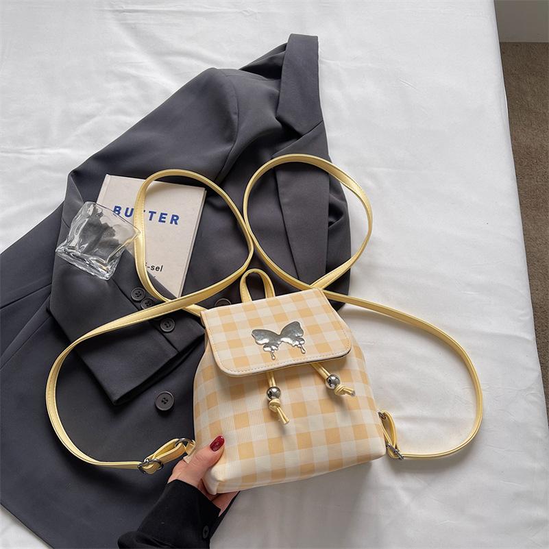 Plaid backpack female fashion niche student class schoolbag bucket bag high value travel small backpack