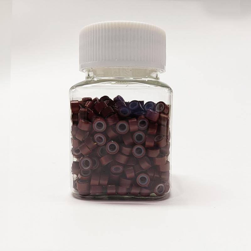 

Бесшовное кольцо для наращивания волос с силиконовой ручкой и золотой проволокой 500 pieces bottled