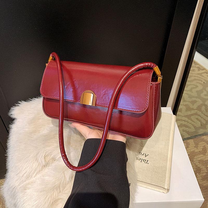 

Underarm baguette bag women s spring and summer new trendy highend sense versatile texture niche retro portable shoulder bag червоний