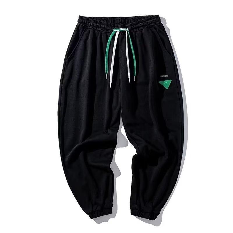 Pantaloni casual bărbați la modă Culoare uni Pantaloni de sport largi la modă Personalitate versatilă Moda Pantaloni harem pentru tineret Pantaloni cu bandă la gleznă Pantaloni de trening negri