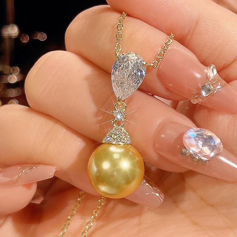 

Ювелирные изделия Медное основание Позолоченная Имитация Золотого Жемчуга Темпераментный Набор с Бахромой Женский 14 мм