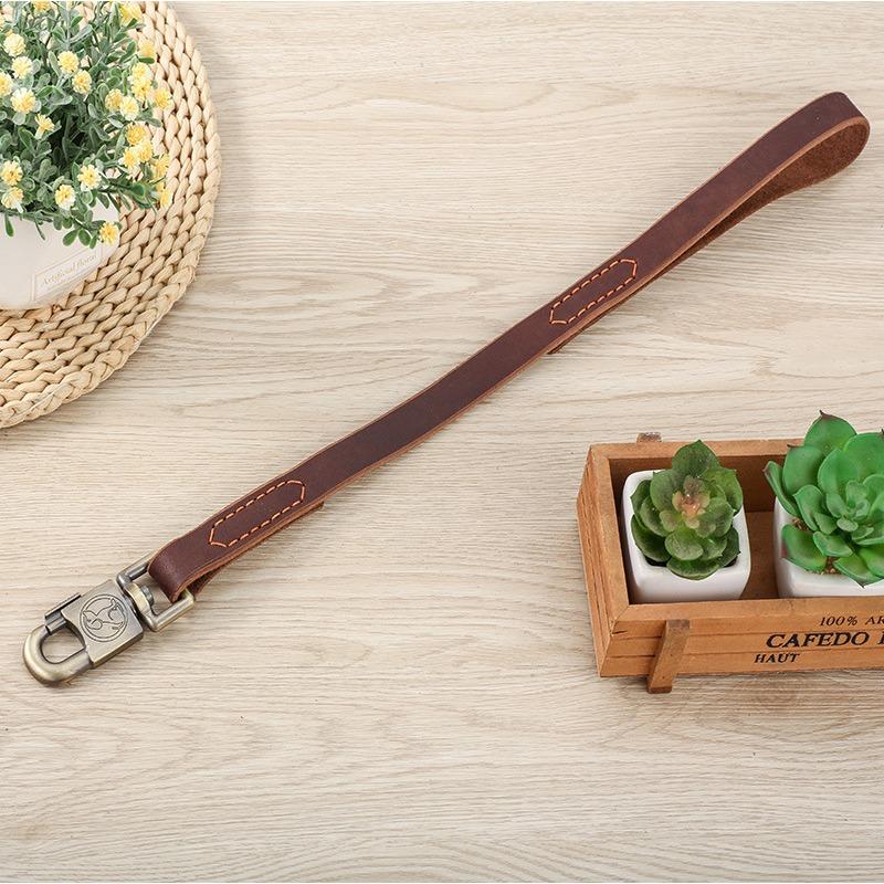 

Поводок из коровьей кожи для собаки Короткий поводок для рывка Одношаговый тренировочный поводок Поводок для следования Поводок Лошадь Собака Золотистый ретривер Поводок из коровьей кожи для собаки 30CM