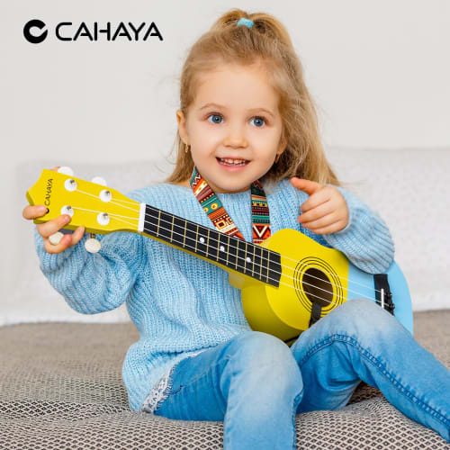 CAHAYA 21-inch Soprano Ukulele Beginner Set with Cartoon Pattern, Nylon Strings, and Linden Wood Finish. 3-Year Warranty. Includes 6-Piece Accessory S
