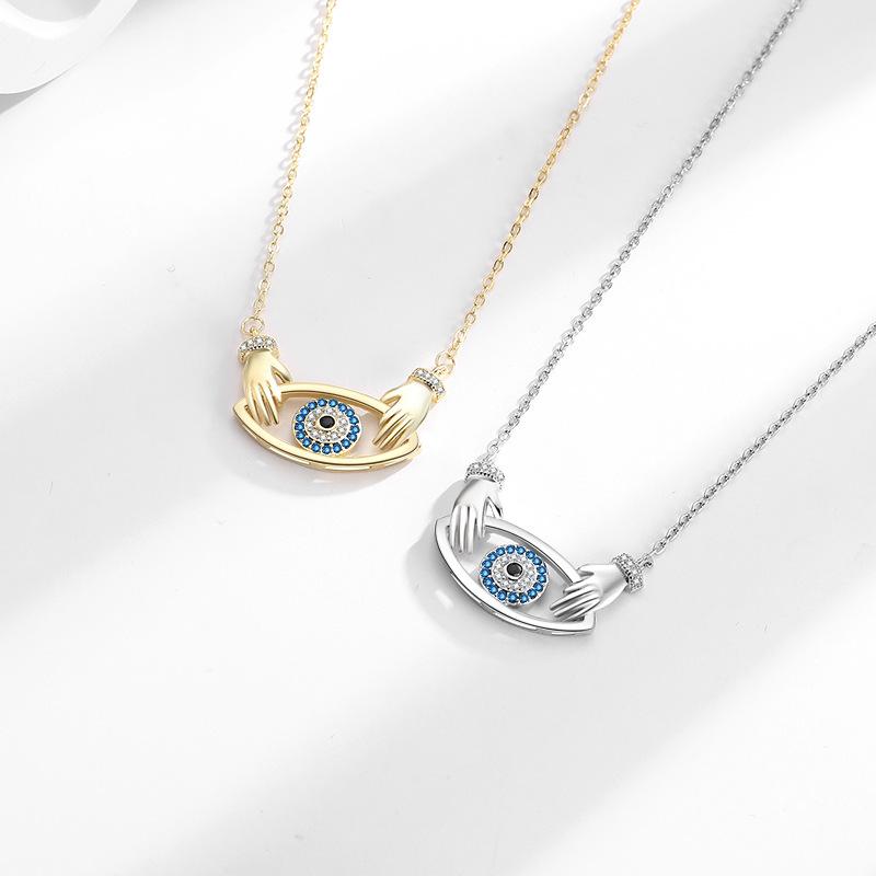 Elegant Devil's Eye Pendant Necklace for Women - European & American Fashion, Double Hand Hug Design, High-End Clavicle Chain
