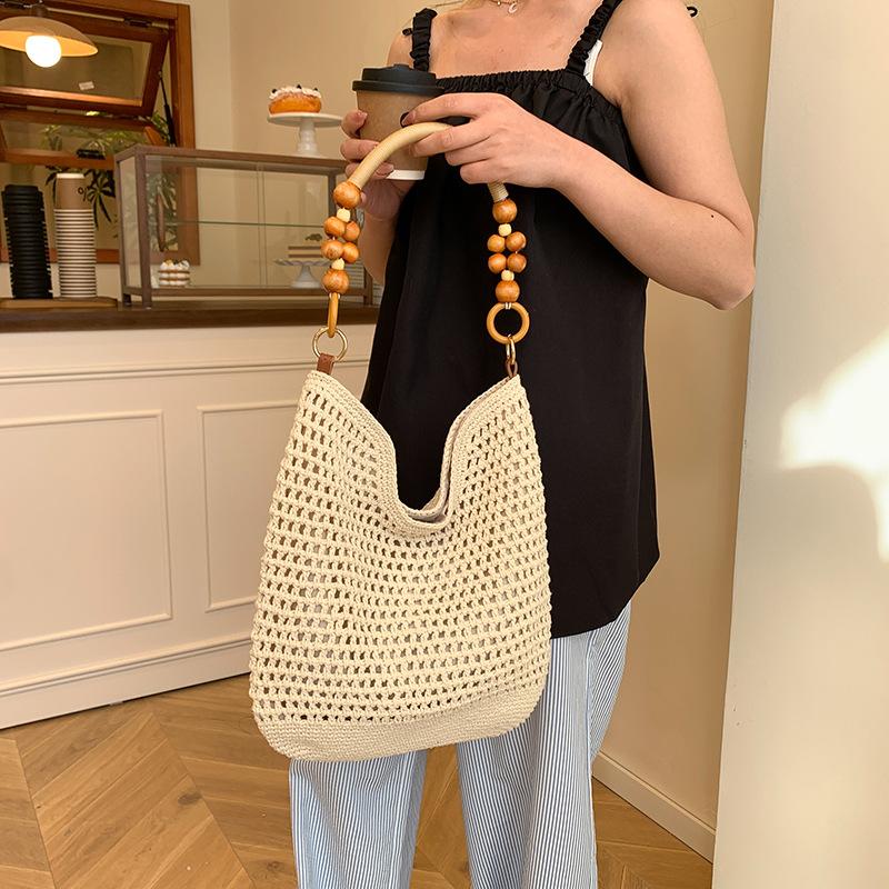 Stylish large-capacity knitted hollow women's tote bag, new exquisite beach vacation hand-woven shoulder bag