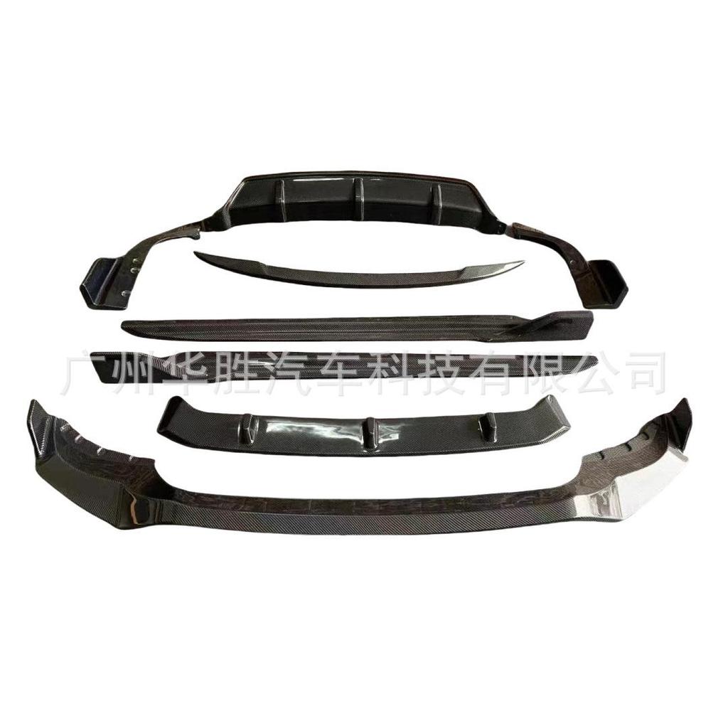 BMW X5 G05 Carbon Fiber Black Warrior Kit: Head Shovel, Front Lip, Side Skirts, Rear Wing, and Corner Spats.