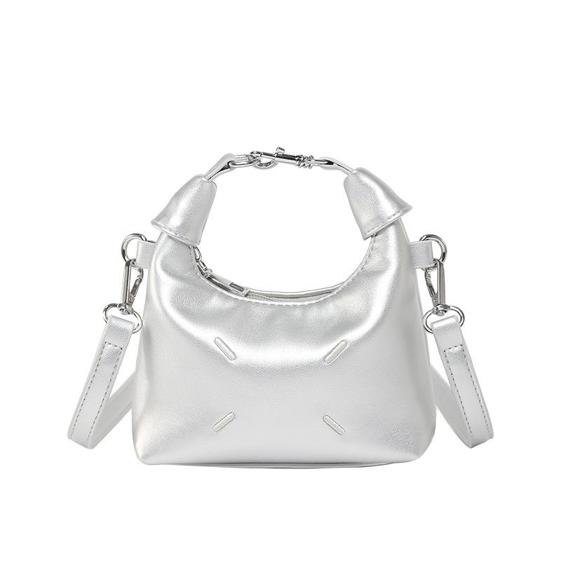 

New niche design simple texture portable dumpling bag temperament versatile commuter casual messenger bag women серебряный