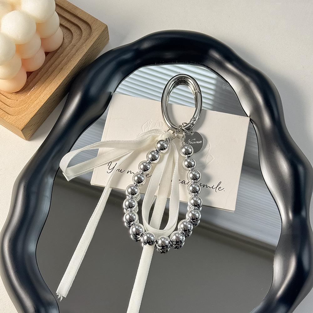 Korean-Style Bow Car Keychain with High-End Silver Bead Ribbon Pendant