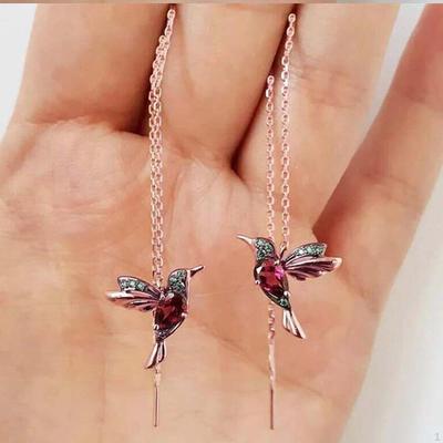 Elegant Dangle Earrings with Bird Pendant and Tassel Detail