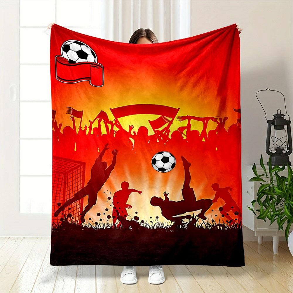 Silhouettes of soccer players and cheering crowd on a vibrant red backdrop. for all seasons blanket lunch break throw gift
