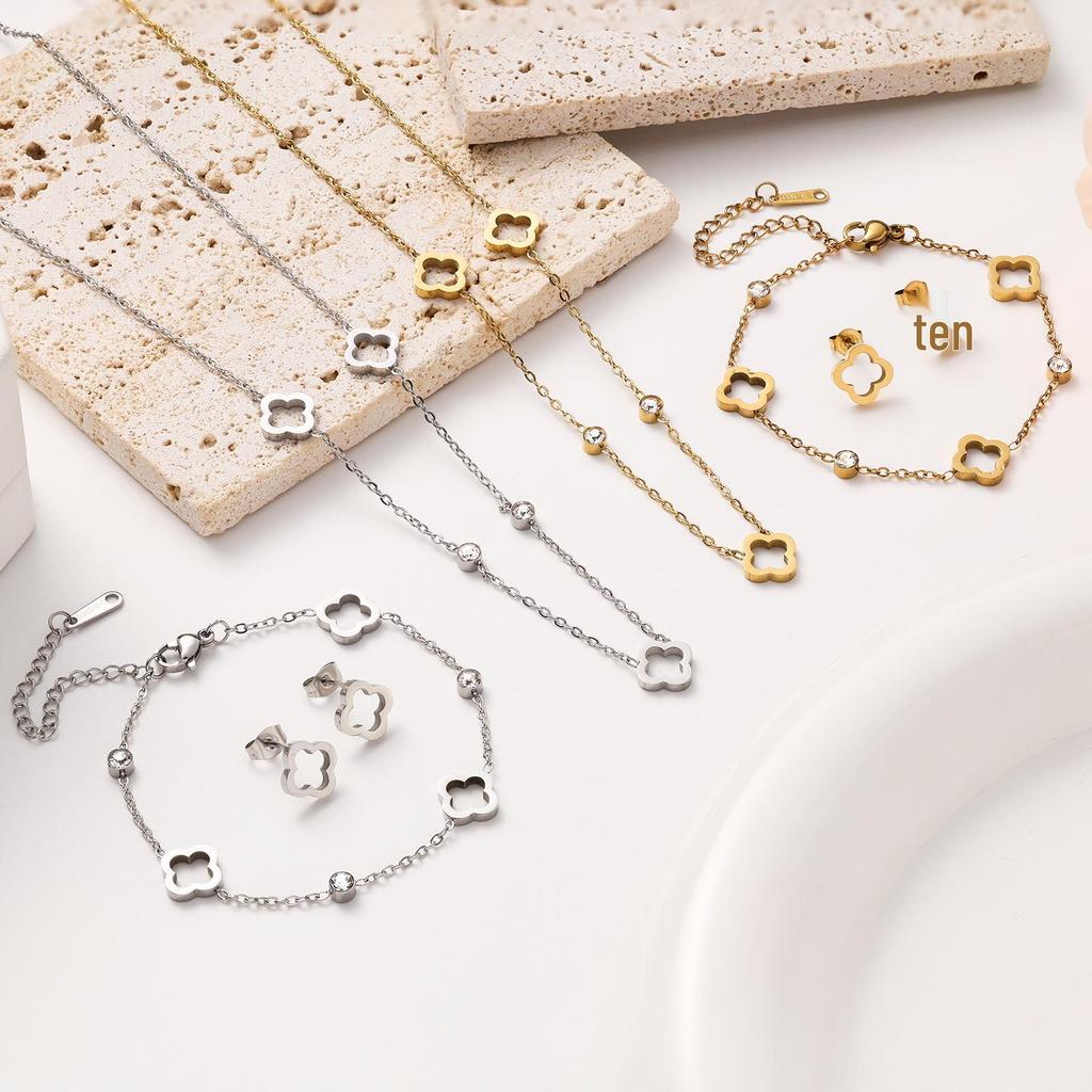 18K Gold Four-Leaf Clover Jewelry Set: Necklace, Bracelet, and Earrings in Titanium Steel with Zirconia.