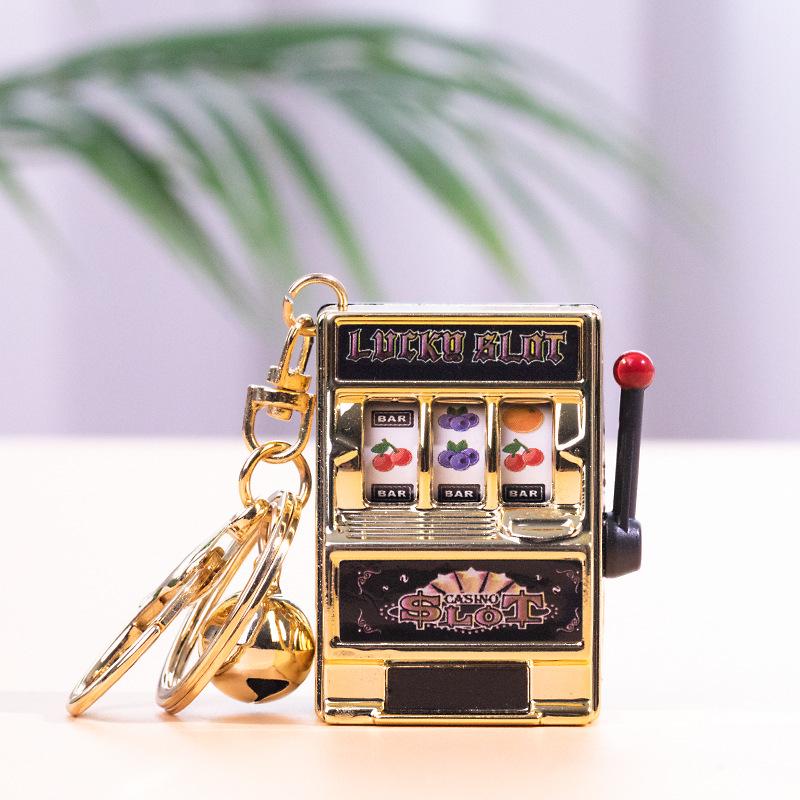 Gold-Plated Creative Tiger Fruit Machine Keychain Toy with Lottery Play Feature