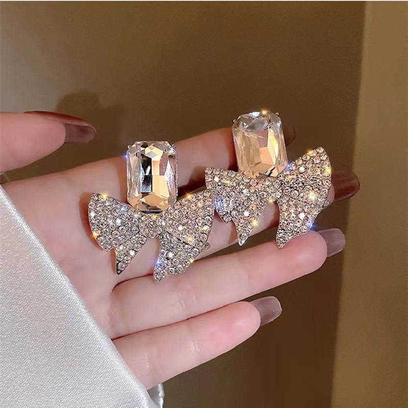 Sterling Silver Bow Crystal Drop Earrings: European & American Fashion.