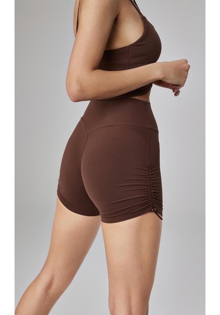 Bare-Feel High-Waisted Yoga Shorts: Butt-Lifting, Peach Drawstring, Three-Quarter Fitness Pants for Women.