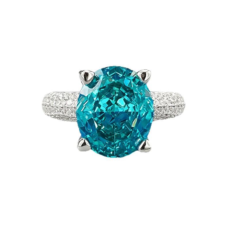 Xiancan Jewelry S925 Silver Oval Paraiba Ice Flower Cut Ring with High Carbon Diamond.