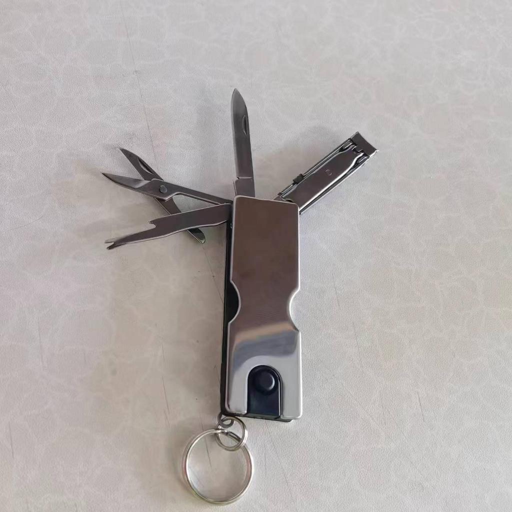 Popular Mini Multifunction Nail Beauty Tool: Folding Knife with LED, Scissors, and Clippers