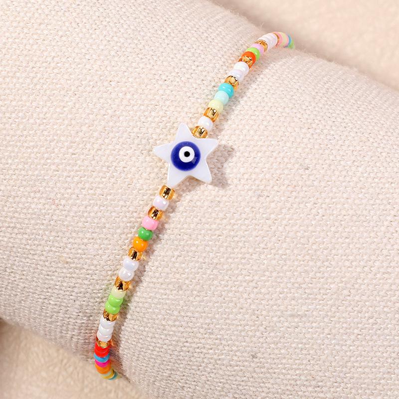 Bracelet en perles d'œil du diable tissé à la main avec motif de niche en verre