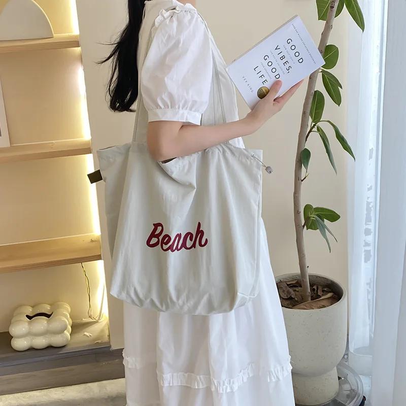 Einfarbige Damen Strand-Schultertasche mit Buchstaben-Design, Damen-Tote aus Canvas, Große Kapazität, Kordelzug, Damen-Einkaufstasche