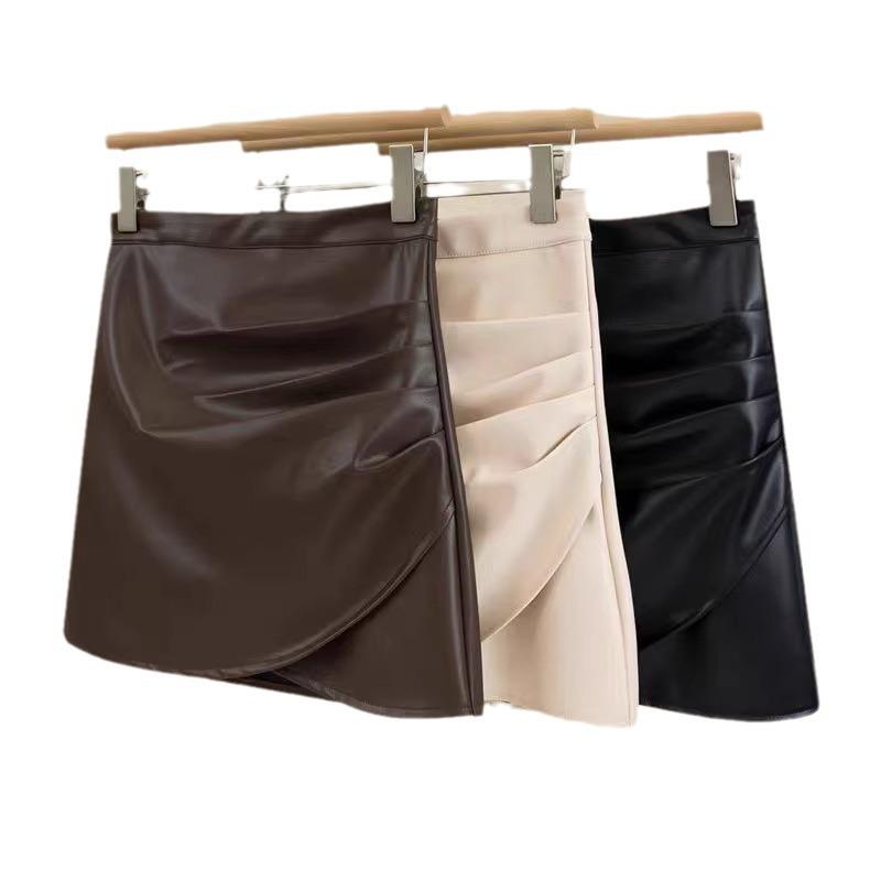 Women's Black Mini Leather Skirt: High-Waisted, Pleated A-Line, Plus Size, Anti-Exposure, Slimming Design for Spring and Autumn.