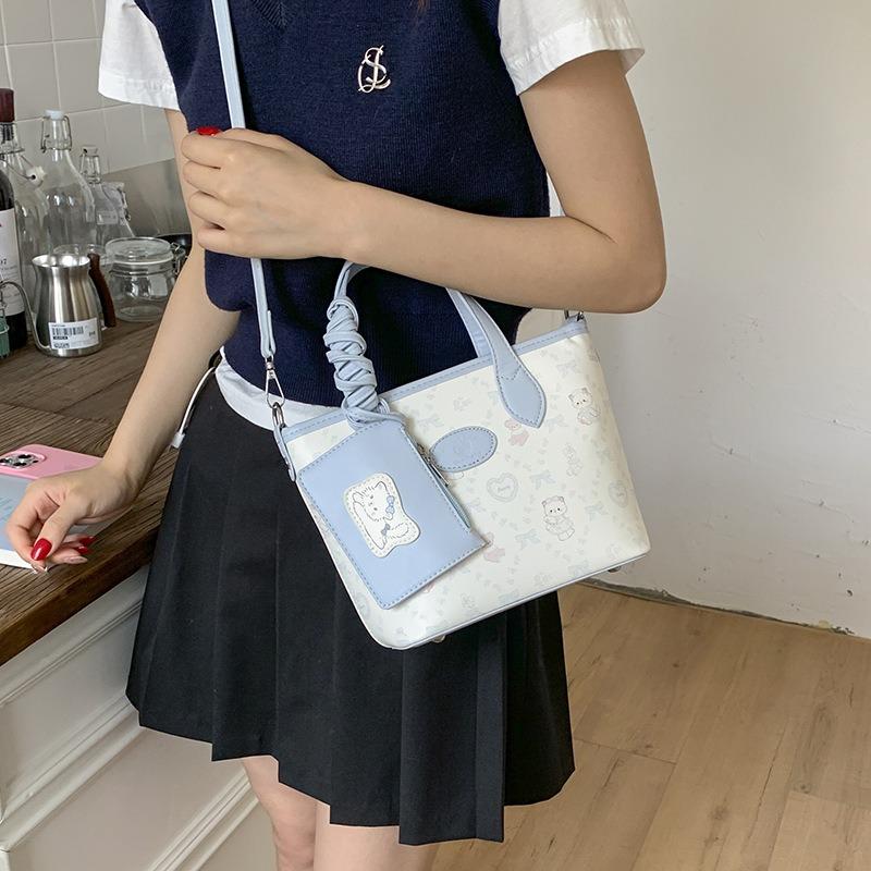 New versatile bucket bag women's high-end oblique span bag fashionable and simple commuter portable shoulder bag