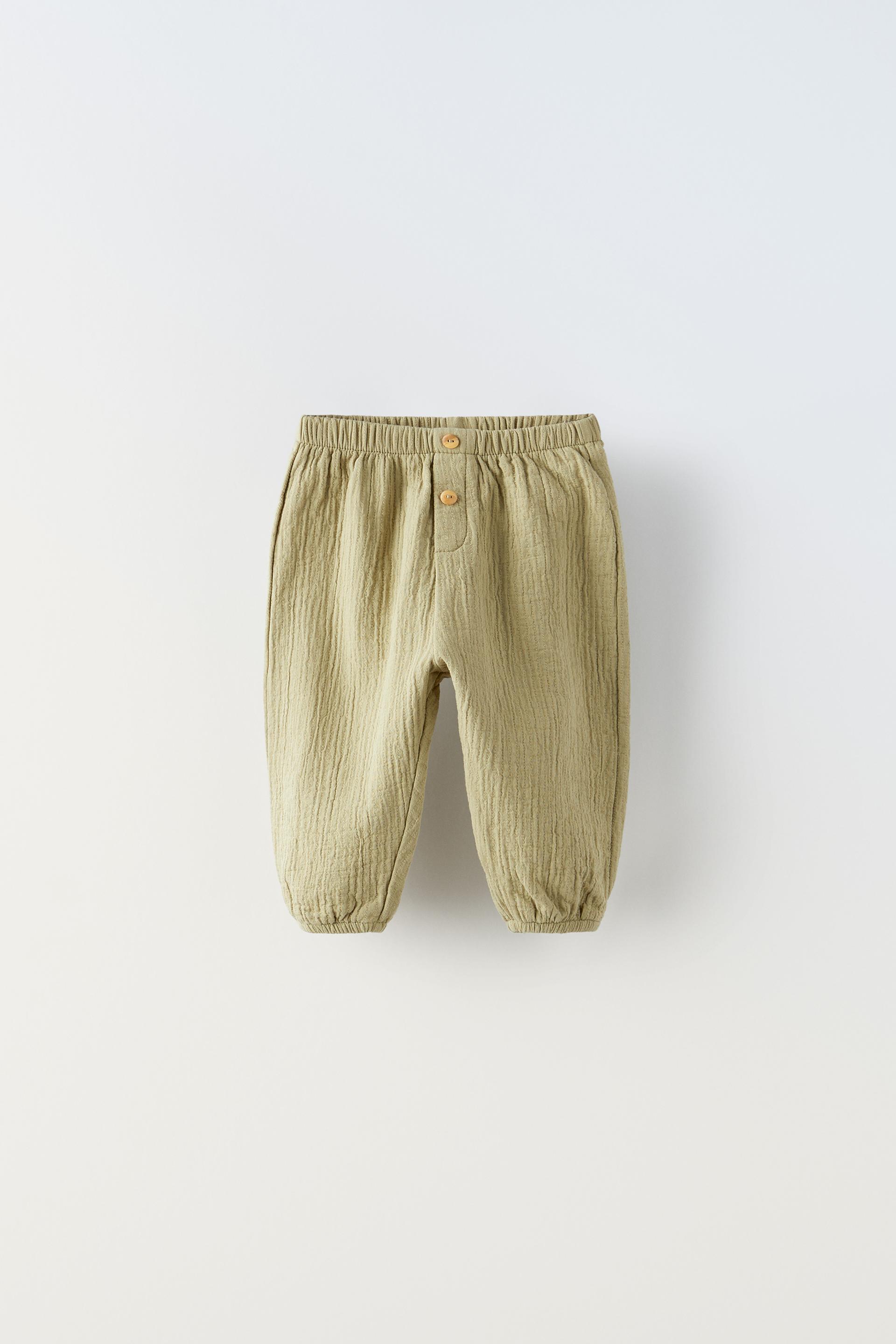 

БРЮКИ С ТЕКСТУРИРОВАННОЙ ОТСТРОЧКОЙ