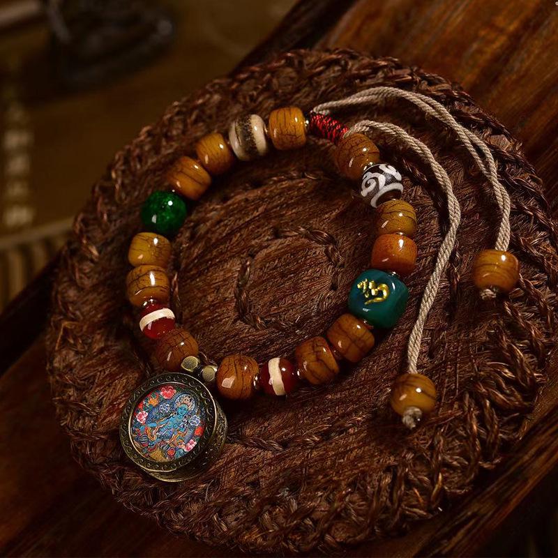 

Tibetan Camel Bone Bracelet with Green Tara Pendant