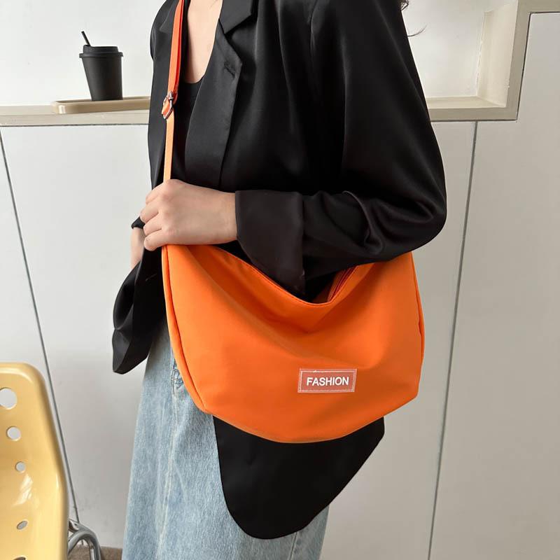 Fashionable And Minimalistic Dumpling Bag For Women Spacious Shoulder Bag Available In Black White Green Red Orange And Pink