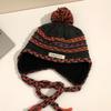 Cozy Chic Knitted Winter Hat For Women Featuring Colorful Pom Poms And Warmth