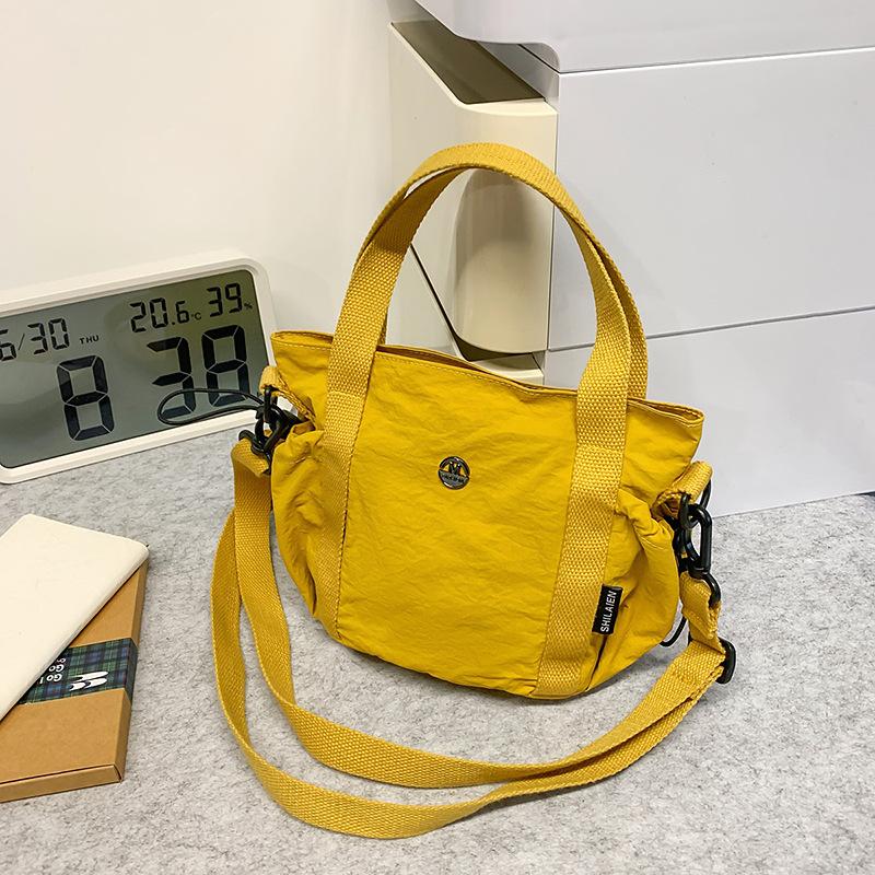 New casual handbag bucket bag fashion niche design bucket bag women's lightweight spring shoulder messenger bag