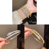 Bracciale di lusso a forma di serpente in rame placcato oro con accenti di zirconi per fashioniste