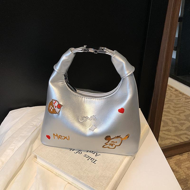 

Cute cartoon puppy embroidered handbag female 2025 spring and summer new bucket bag shoulder versatile messenger bag серебряный