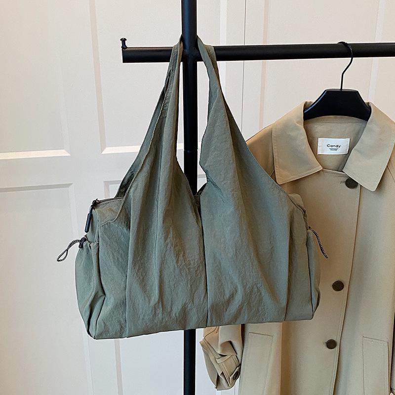 

Trendy Pleated Multi-Pocket Tote: Versatile, Lightweight, Large-Capacity Shoulder Bag 2026