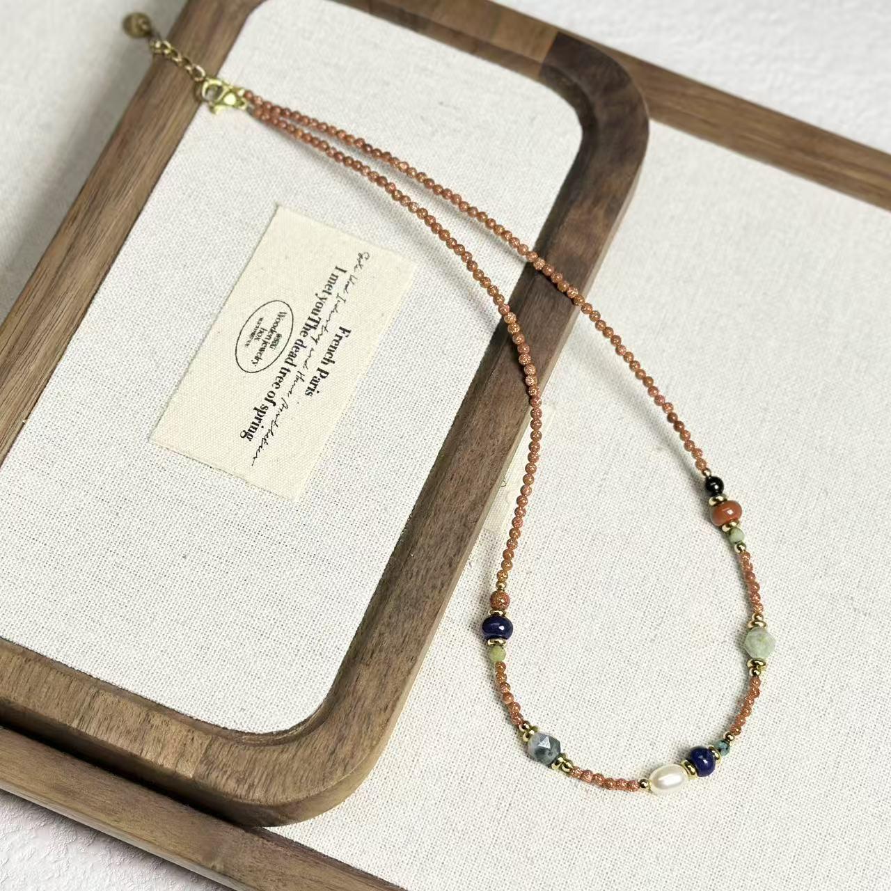 

Retro Beaded Necklace with Egg Yolk Stone, Freshwater Pearl, and Clavicle Chain in Ethnic Style