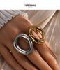 Luxury Geometric Stainless Steel Ring with Bold Lines and Irregular Hollow Design.
