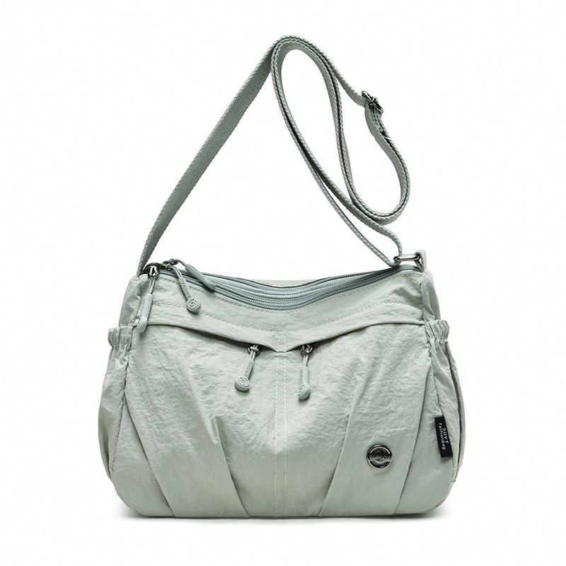 

Large capacity messenger bag women s new work commuter shoulder bag light travel simple satchel three-layer zipper bag