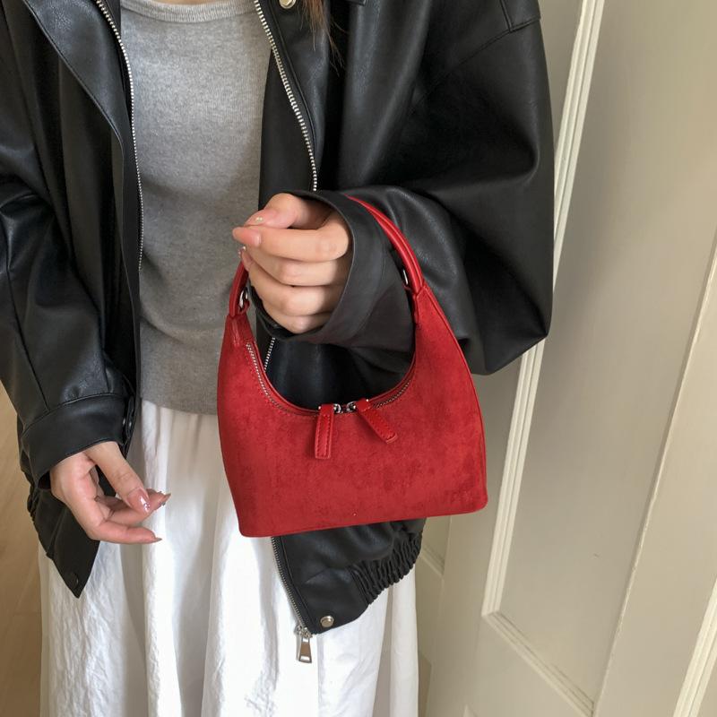 Retro fashion dumpling bag women 2025 new bag high sense light luxury niche commuting single shoulder cross hand bag