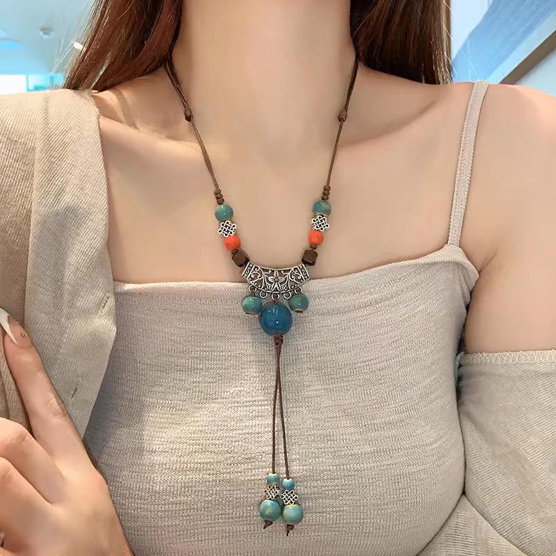 Bohemian Ethnic Style Long Bow Metal Necklace with Vintage Distressed Pendant (2025)