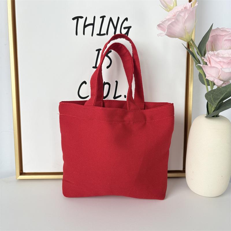 Effenkleurige eenvoudige lunchtas, draagbare canvas tas, kleine stoffen tas, draagbare canvas tas voor het opbergen van diverse spullen